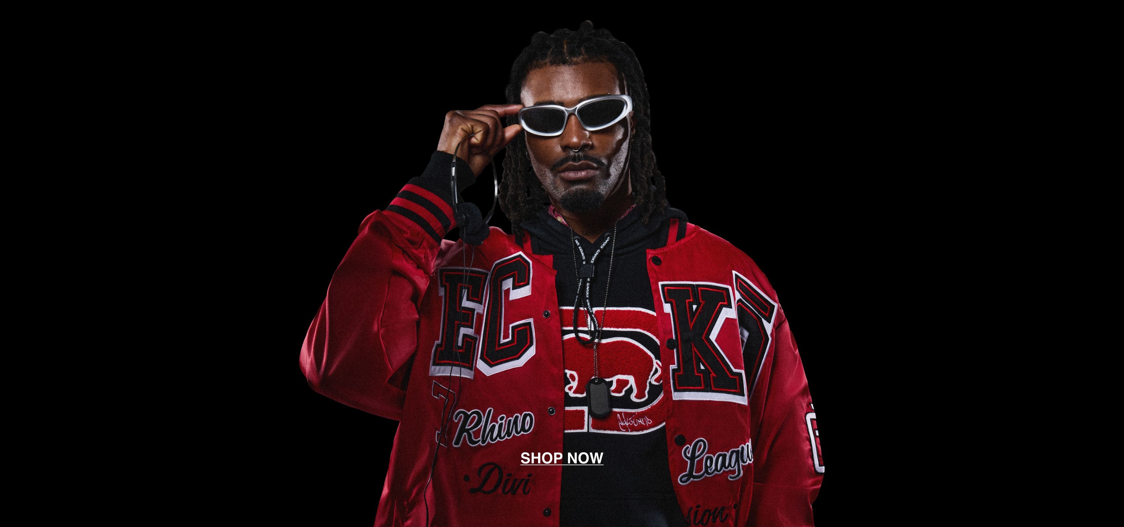 Man wearing a black Ecko Unltd hoodie underneath a red Ecko Unltd varsity jacket. The jacket features a classic letterman style with a large 'ECKO' on the front.